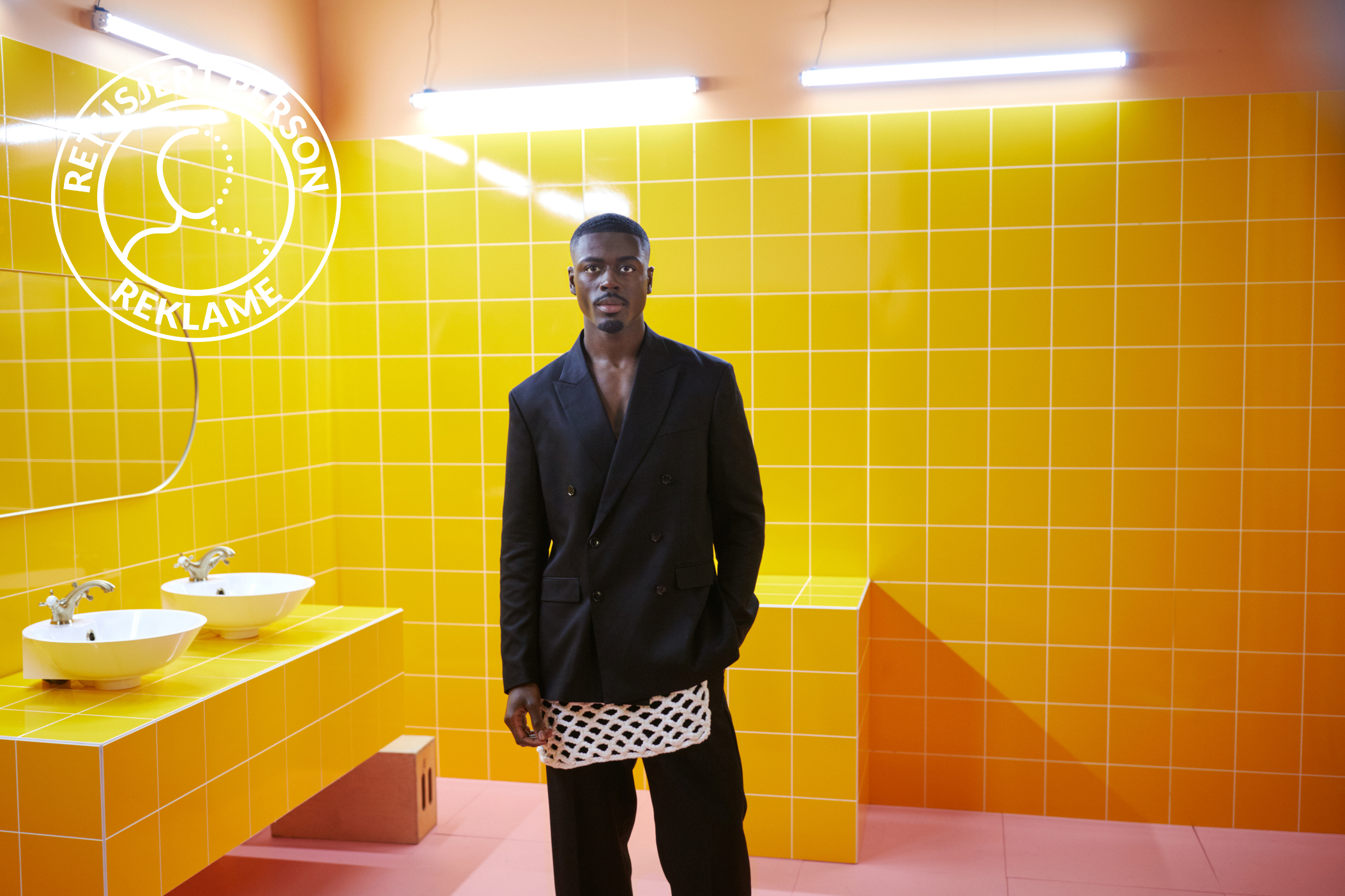 On set with H&M's loyalty program, in a yellow bathroom set.
